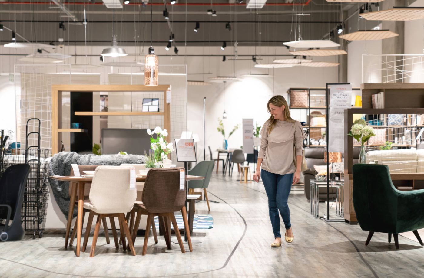 Woman browsing in a contemporary furniture store.